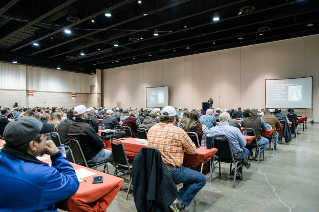Farmers listen to a speaker at the Soil Health Symposium.