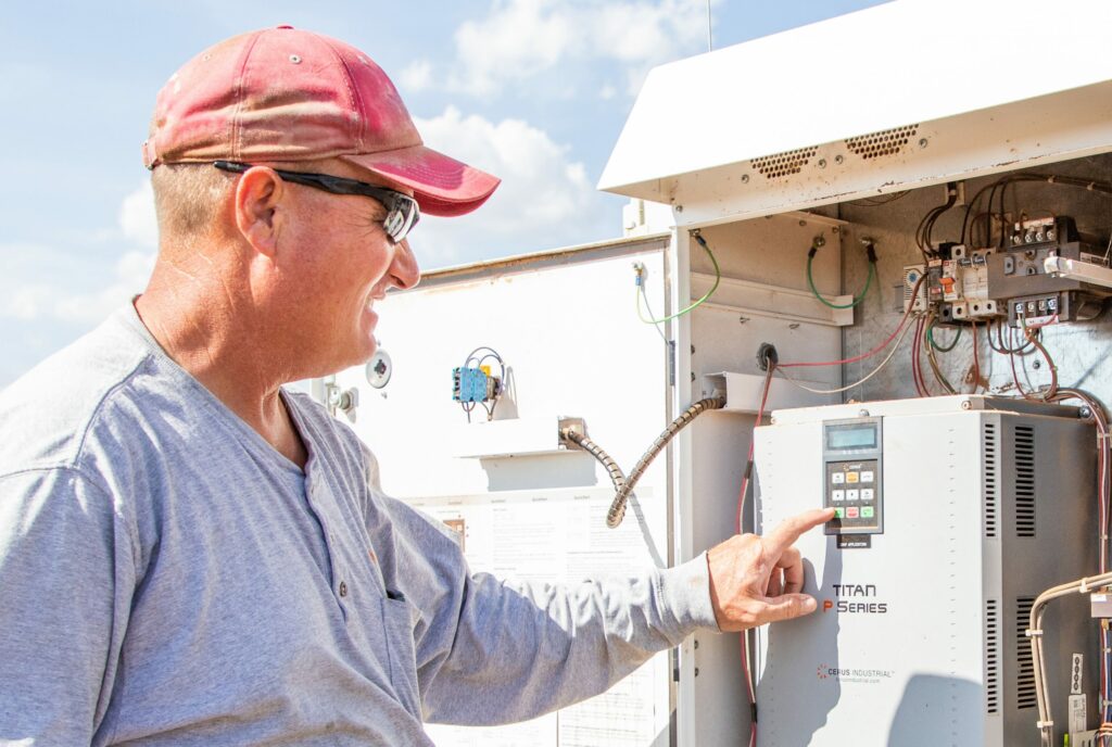 Farmer working with irrigation equipment