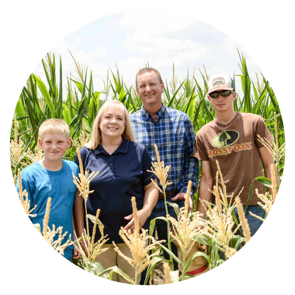 The Schronk family in a corn field.