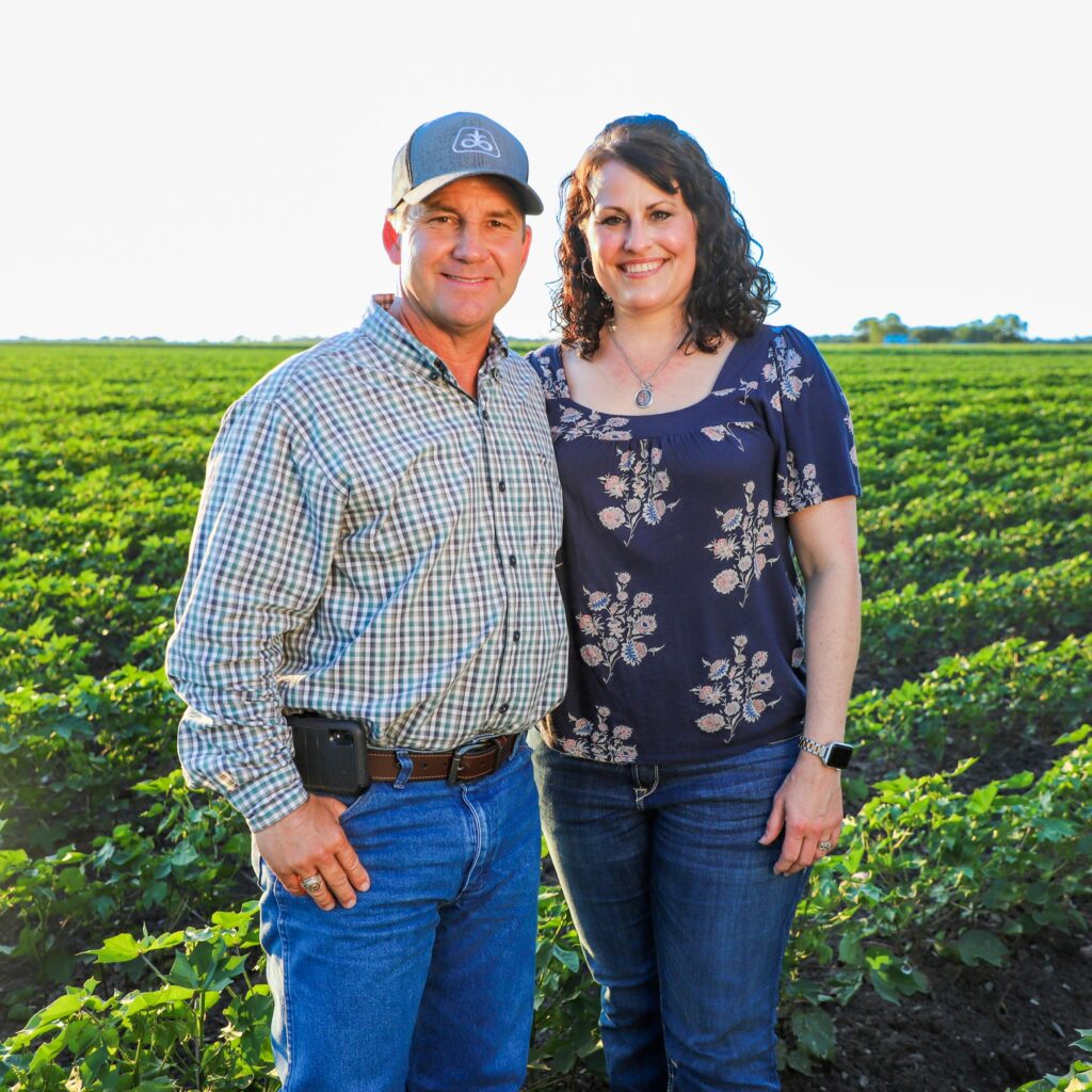 Keith Kresta and his wife in a field